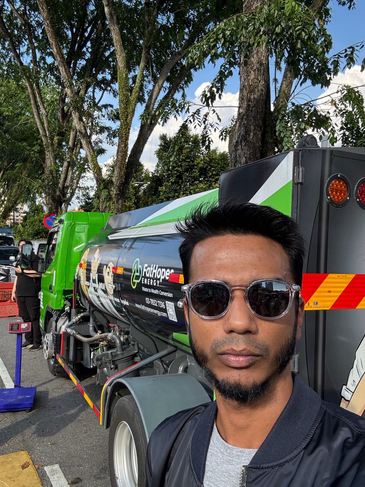 Vinesh Sinha in front of a FatHopes Energy used cooking oil tanker